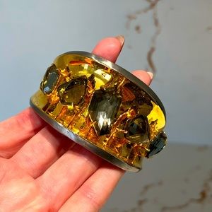 Alexis Bittar gold cuff with grey stones.